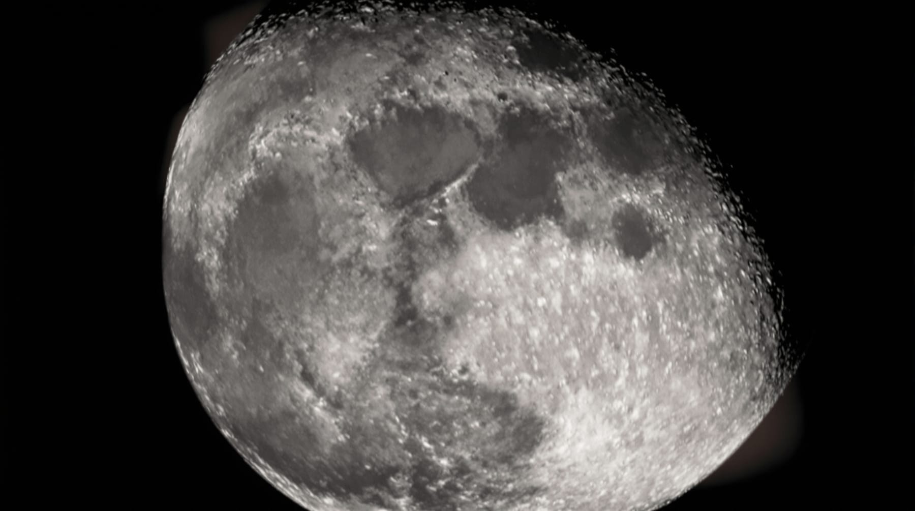The first quarter Moon showing craters and mountains along the terminator