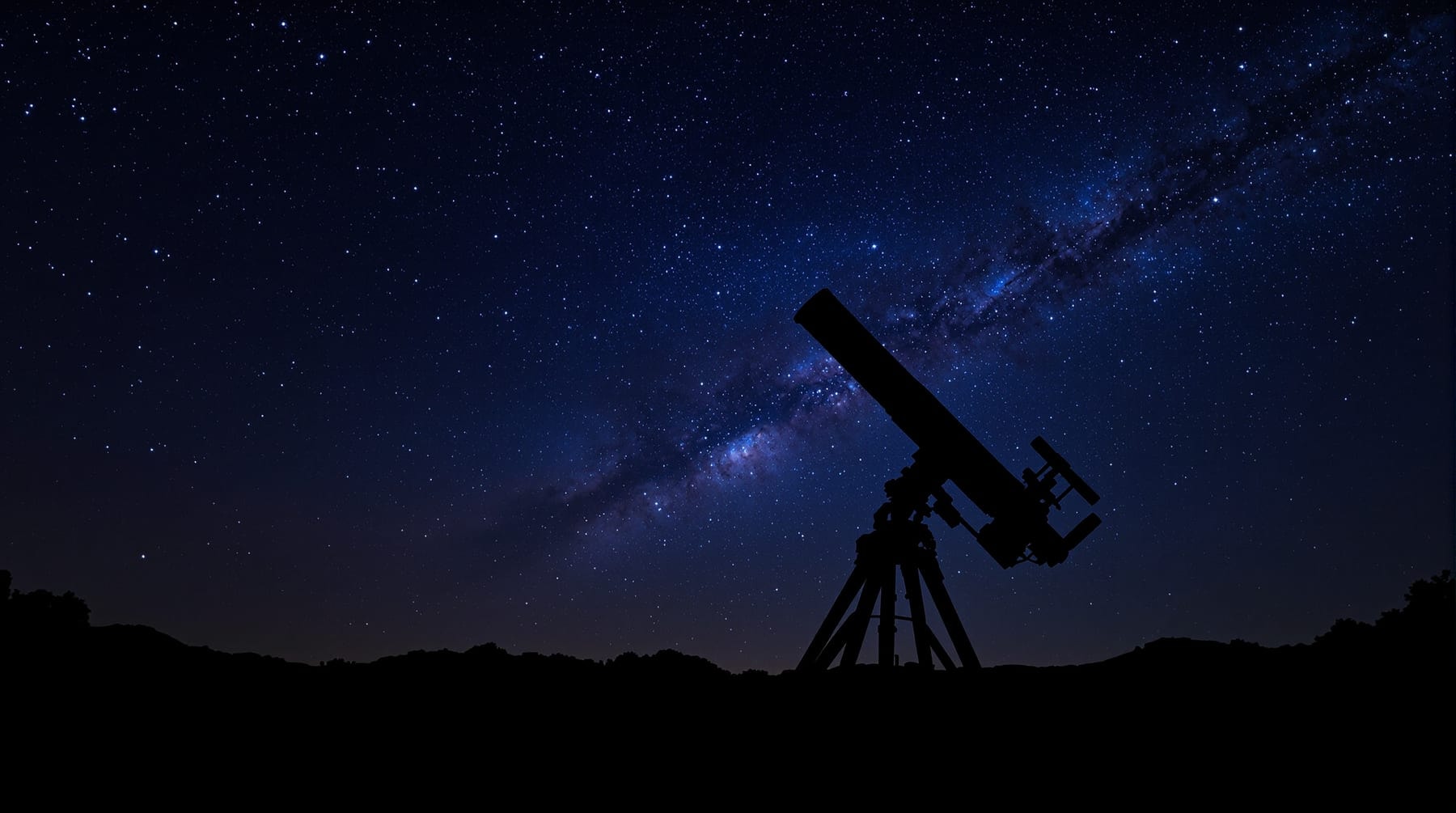 A wooden Dobsonian telescope silhouetted against a star-filled sky