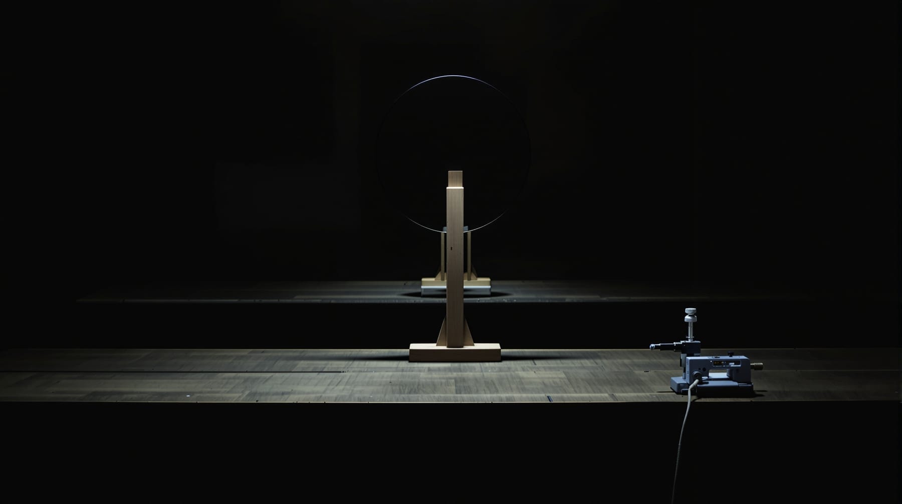 A workshop set up for a Foucault knife-edge test with a mirror on a tilt stand
